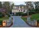 Stunning two-story home with a well-manicured lawn, beautiful trees, and a charming driveway at 3 Demorest Ne Ave, Atlanta, GA 30305