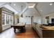 Spacious game room with vaulted ceilings, recessed lighting, pool table, and comfortable seating at 3 Demorest Ne Ave, Atlanta, GA 30305