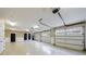 Spacious four car garage with multiple windows and doors and ceiling mounted lighting at 3 Demorest Ne Ave, Atlanta, GA 30305