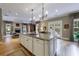 Elegant kitchen with a large island and seamless flow into a cozy living area with a fireplace at 3 Demorest Ne Ave, Atlanta, GA 30305