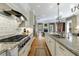 Spacious kitchen with granite countertops, stainless steel appliances, and adjacent living area at 3 Demorest Ne Ave, Atlanta, GA 30305