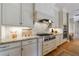 Gourmet kitchen with granite countertops, professional appliances, and custom cabinetry at 3 Demorest Ne Ave, Atlanta, GA 30305
