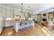 Open kitchen featuring granite countertops, island with seating, and modern appliances at 3 Demorest Ne Ave, Atlanta, GA 30305