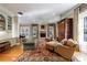 Comfortable living area features a fireplace, hardwood floors, and ample seating, creating an inviting space at 3 Demorest Ne Ave, Atlanta, GA 30305