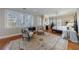 Bright main bedroom featuring hardwood floors, sitting area, and natural light from multiple windows at 3 Demorest Ne Ave, Atlanta, GA 30305