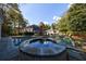 Expansive backyard featuring a large swimming pool with a unique circular spa at 3 Demorest Ne Ave, Atlanta, GA 30305