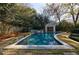 Inviting backyard pool area with a covered gazebo, surrounded by lush landscaping at 3 Demorest Ne Ave, Atlanta, GA 30305