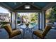 Charming outdoor living space with covered seating area overlooking the sparkling pool at 3 Demorest Ne Ave, Atlanta, GA 30305
