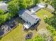A bird's-eye view of a home with a spacious backyard, a deck, and ample parking at 369 Arnold Mill Rd, Woodstock, GA 30188