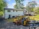 Well-maintained two-story home featuring a spacious backyard with a deck, and construction equipment at 369 Arnold Mill Rd, Woodstock, GA 30188