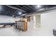 Spacious finished basement with a bar, pool table, and access to a bathroom at 369 Arnold Mill Rd, Woodstock, GA 30188