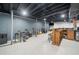 Finished basement with a bar area, exercise equipment, and musical instruments at 369 Arnold Mill Rd, Woodstock, GA 30188