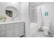 Elegant bathroom features a large vanity, round mirror, and a shower with gray tile at 369 Arnold Mill Rd, Woodstock, GA 30188