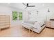 Bright bedroom with neutral decor, ceiling fan and hardwood floors at 369 Arnold Mill Rd, Woodstock, GA 30188