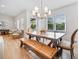 Light-filled dining room featuring a wooden table and bench seating at 369 Arnold Mill Rd, Woodstock, GA 30188
