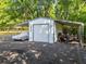 Detached garage featuring covered storage with vehicle and trailer parking at 369 Arnold Mill Rd, Woodstock, GA 30188