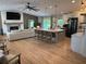 Spacious open-concept living room and kitchen with large island and fireplace at 369 Arnold Mill Rd, Woodstock, GA 30188