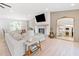 Bright living room with fireplace, adjacent to open floor plan, dining and kitchen at 369 Arnold Mill Rd, Woodstock, GA 30188