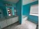 Well-lit bathroom with a tub and double sink vanity featuring a large framed mirror at 4341 Savannah Ln, Atlanta, GA 30349