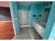 Bright bathroom with double sinks, white cabinets and a glass-enclosed shower at 4341 Savannah Ln, Atlanta, GA 30349