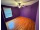 Bright bedroom with wood floors and a large window at 4341 Savannah Ln, Atlanta, GA 30349
