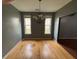 Dining room features hardwood floors, a chandelier, and a large window at 4341 Savannah Ln, Atlanta, GA 30349