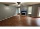 Spacious living room with a ceiling fan and fireplace at 4341 Savannah Ln, Atlanta, GA 30349