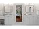 This is a spacious bathroom with double vanity and lighting and a door into the bedroom at 4592 Planters Hill Dr, Powder Springs, GA 30127