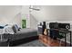 This upstairs bedroom has hardwood floors, lots of light, and space for both sleeping and studying at 4592 Planters Hill Dr, Powder Springs, GA 30127