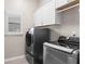 Convenient laundry room with modern washer and dryer at 4592 Planters Hill Dr, Powder Springs, GA 30127