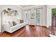 Comfortable living room with sofa, windows, and neutral decor at 4592 Planters Hill Dr, Powder Springs, GA 30127