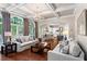 Open concept living room boasts hardwood floors and seamless flow to dining and kitchen at 4592 Planters Hill Dr, Powder Springs, GA 30127