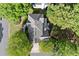 Aerial view showing the roofline, driveway and mature landscaping of this well-maintained home at 5620 Preserve Cir, Johns Creek, GA 30005