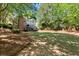 Spacious backyard featuring lush greenery and a large grassy area ideal for outdoor activities and entertainment at 5620 Preserve Cir, Johns Creek, GA 30005