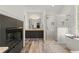 This bathroom features granite counters, a fireplace, a glass shower, and a soaking tub at 5620 Preserve Cir, Johns Creek, GA 30005