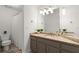 Bathroom with vanity, granite countertops, large mirror, and a shower at 5620 Preserve Cir, Johns Creek, GA 30005