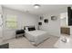Well-lit bedroom with simple decor and an en-suite bathroom at 5620 Preserve Cir, Johns Creek, GA 30005
