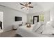 Primary bedroom featuring neutral color palette, tray ceiling and ceiling fan at 5620 Preserve Cir, Johns Creek, GA 30005