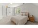 Cozy bedroom with neutral tones, natural light, and decorative wall art at 5620 Preserve Cir, Johns Creek, GA 30005