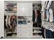 Walk-in closet features custom shelving and storage solutions at 5620 Preserve Cir, Johns Creek, GA 30005