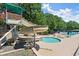 Community pool area featuring a slide, wading pool, and plenty of space for lounging in the sun at 5620 Preserve Cir, Johns Creek, GA 30005