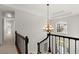 Open foyer with soaring ceiling, chandelier and access to living spaces at 5620 Preserve Cir, Johns Creek, GA 30005