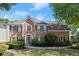 Charming brick home featuring a manicured lawn, tasteful landscaping and a welcoming front entrance at 5620 Preserve Cir, Johns Creek, GA 30005