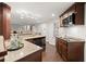 Gourmet kitchen features granite countertops and stainless steel appliances at 5620 Preserve Cir, Johns Creek, GA 30005