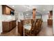 Kitchen featuring a stone bar, stainless steel appliances, and wooden cabinets at 5620 Preserve Cir, Johns Creek, GA 30005