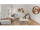 Bright living room with hardwood floors, neutral decor, and modern accents at 5620 Preserve Cir, Johns Creek, GA 30005