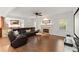 Inviting living room with a fireplace, bar area, and leather seating, perfect for Gathering and entertaining at 5620 Preserve Cir, Johns Creek, GA 30005