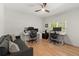 Spacious home office with two workstations, hardwood floors and natural light at 5620 Preserve Cir, Johns Creek, GA 30005