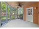 Cozy screened porch providing a relaxing outdoor space with natural light and access to the backyard at 5620 Preserve Cir, Johns Creek, GA 30005