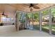 Spacious screened porch with access to the backyard and a staircase, perfect for outdoor entertaining at 5620 Preserve Cir, Johns Creek, GA 30005